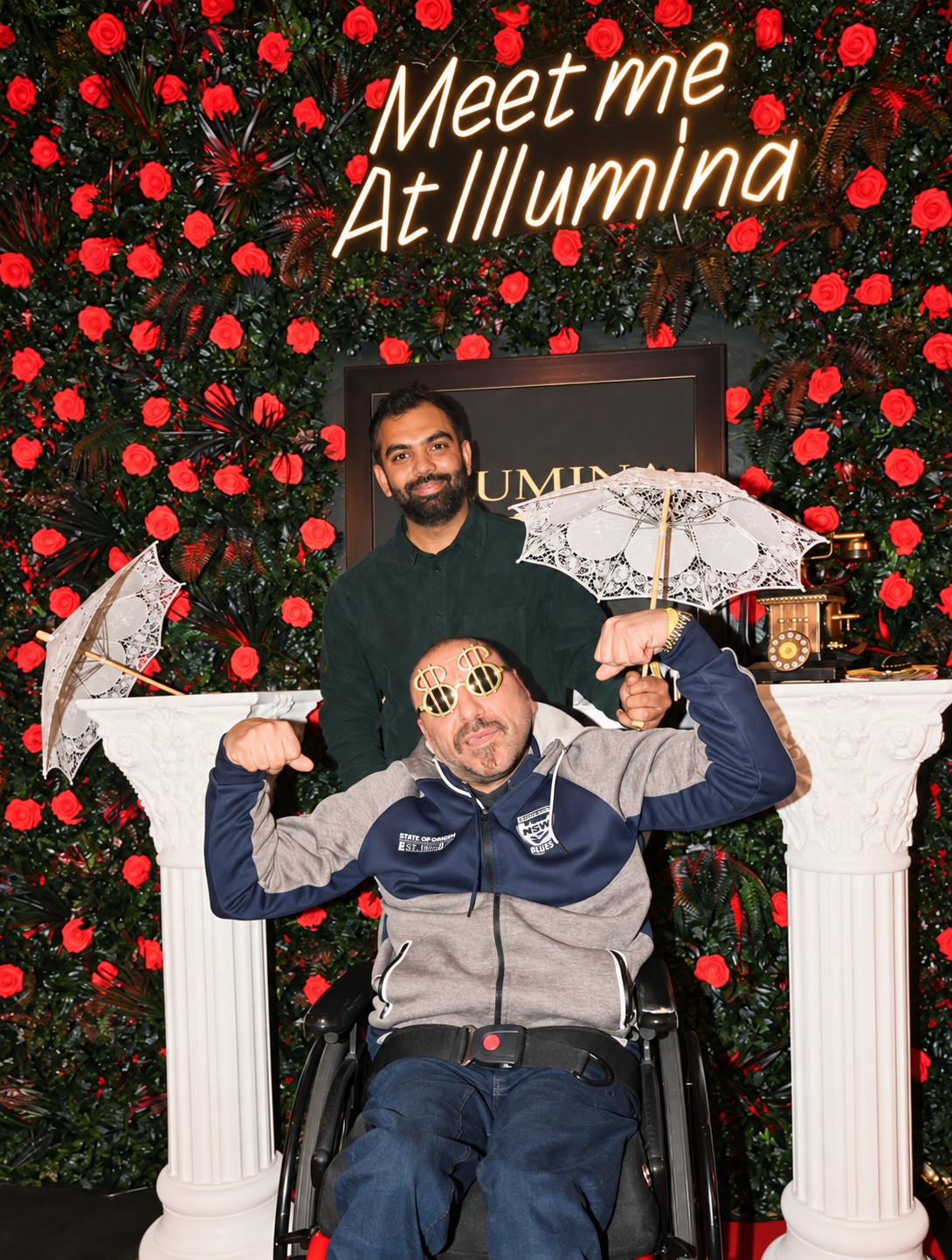 Guests enjoying Illumina's rose-wall photo spot