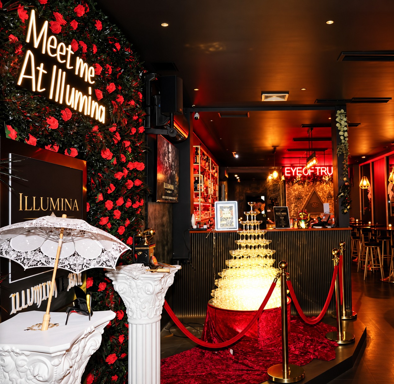 Illumina's rose wall, cocktail tower and black-and-gold bar interior